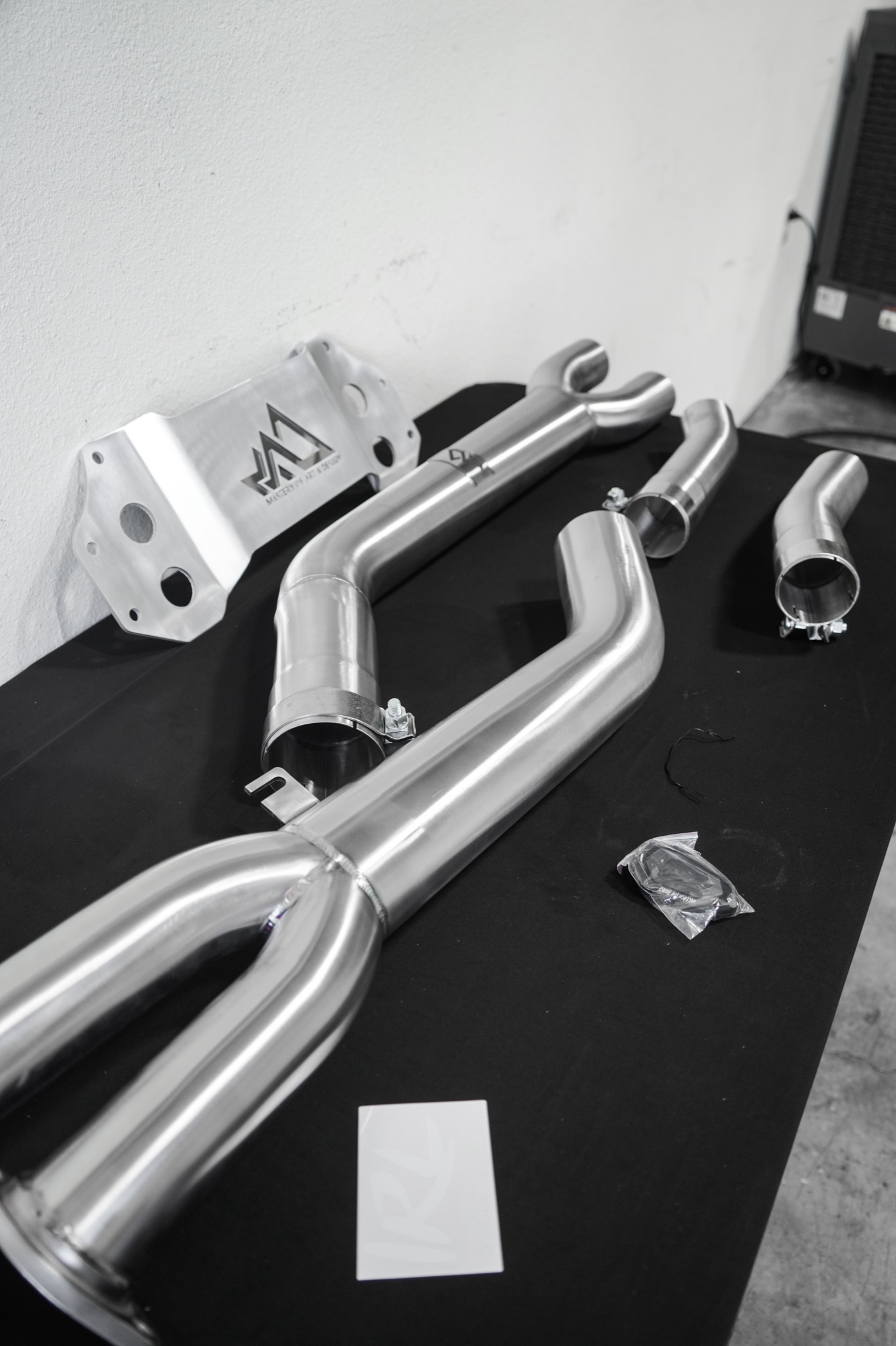 Custom exhaust system laid out on the bench
